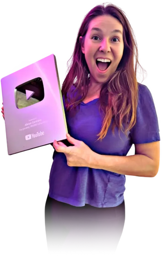 Allison Carmany holding her YouTube silver play button award